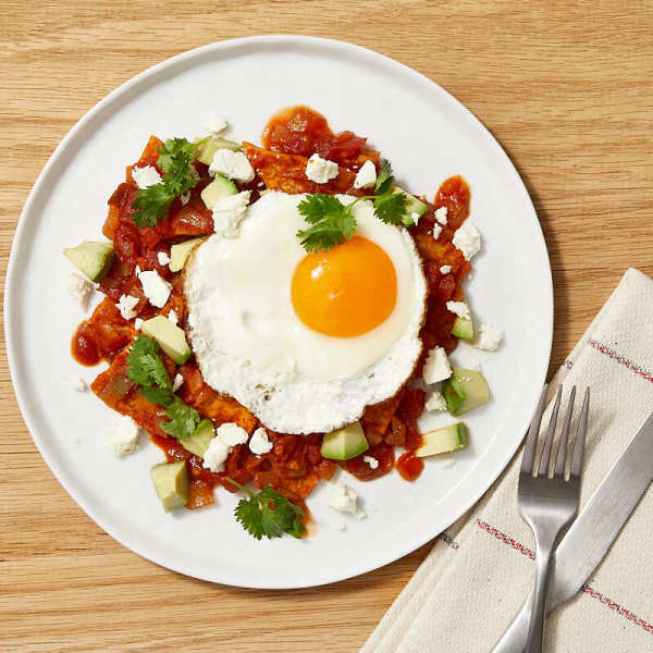 Photo of Chilaquiles with Fried Eggs, Cheese, and Avocado by WW