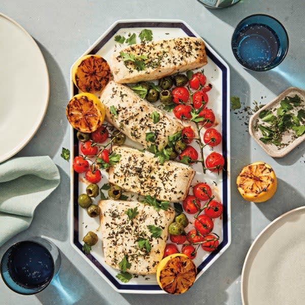 Photo of Grilled halibut with charred tomatoes, lemons, and olives by WW