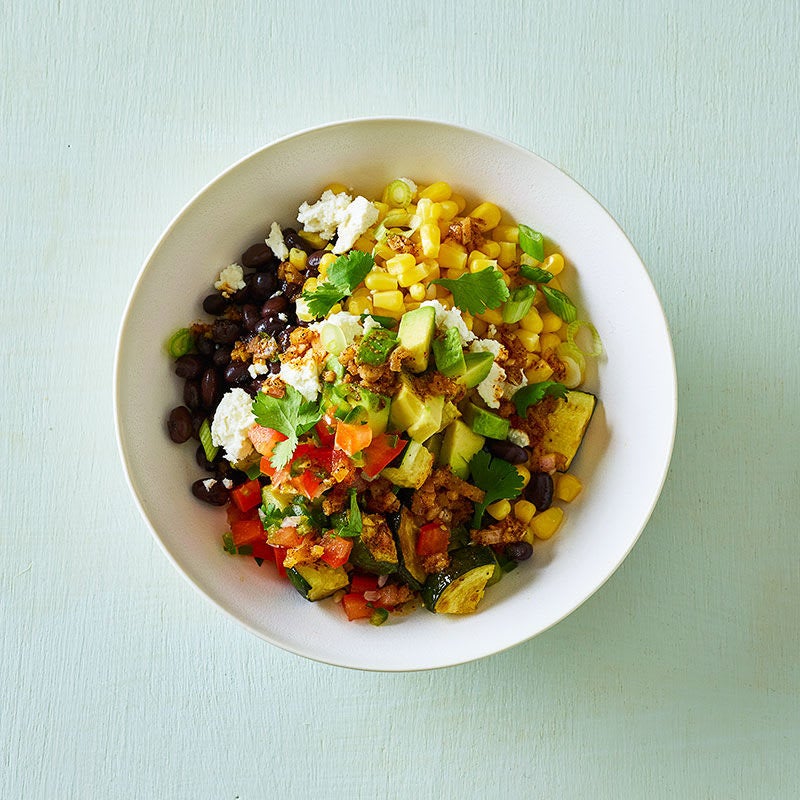 Photo of Mexican black bean, zucchini and corn bowl with cumin-lime drizzle by WW
